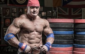 A ripped Mark Bell in his gym.
