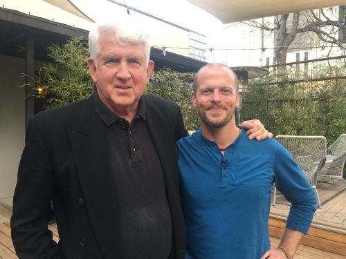 Bob Metcalfe and Tim Ferriss in a photo-op on an outdoor patio.