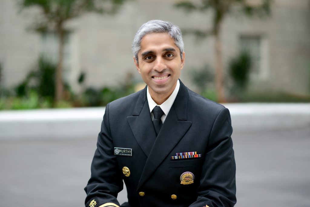 Dr. Vivek Murthy in his surgeon general uniform, smiling.