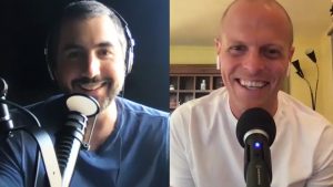 Tim Ferriss and Kevin Rose in front of microphones while on a video call with each other.