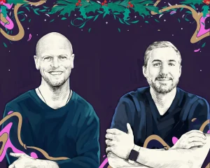 Artist's rendering of Tim Ferriss and Kevin Rose framed in a festive border with abstract gold and pink swishes on sides and bottom and holly leaves and berries above.